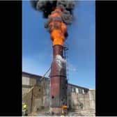 Fire erupts from the chimney at the maggot breeding farm in Doncaster.