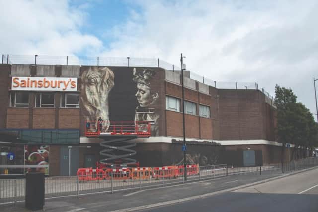The mural is located by the Doncaster train station. 
Photo by: Street Art Atlas.