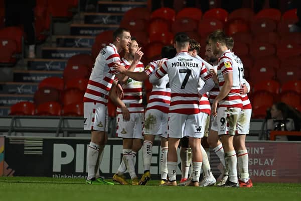 Doncaster's players celebrate Ben Close's goal against Tranmere.