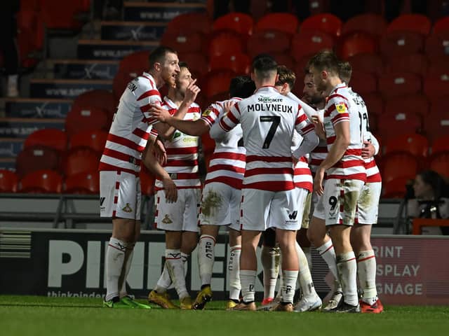 Doncaster's players celebrate Ben Close's goal against Tranmere.