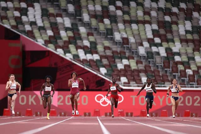 (l-r) Elaine Thompson-Herah, Beth Dobbin, Crystal Emmanuel, Gabrielle Thomas, Gina Bass, Christine Mboma and Rafalia Spanoudaki-Chatziriga compete in the women's 200m semi-finals. Photo by Ryan Pierse/Getty Images