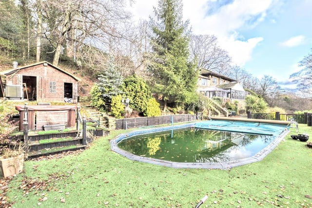 Offers over £695,000 are being invited for this four-bedroom detached house in Silkstone - it has an outdoor summer house including a bar, an outdoor swimming pool and a hot tub. (https://www.zoopla.co.uk/for-sale/details/53724362)