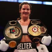Terri Harper celebrates with the WBA and IBO world super welterweight title belts after defeating Hannah Rankin. Photo: Nathan Stirk/Getty Images