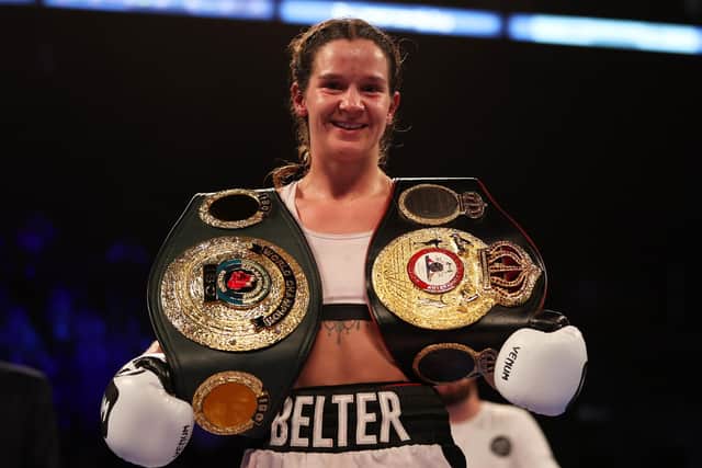 Terri Harper celebrates with the WBA and IBO world super welterweight title belts after defeating Hannah Rankin. Photo: Nathan Stirk/Getty Images