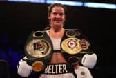 Terri Harper celebrates with the WBA and IBO world super welterweight title belts after defeating Hannah Rankin. Photo: Nathan Stirk/Getty Images