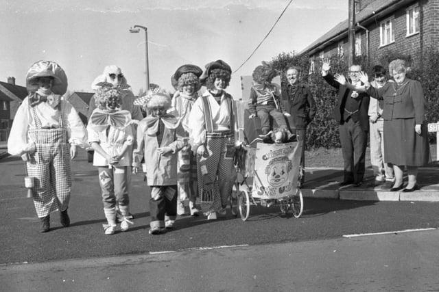 The clowning Kirkby family turned a few heads as they raced through the streets pushing a pram. The Kirkby's of Studholme Crescent, Penwortham, were raising money for the children's spinal unit at Royal Preston Hospital, where 16-year-old Spencer Kirkby, has been a patient. Seven members of the family trekked 15 miles in fancy dress through Lostock Hall, Bamber Bridge and Penwortham. They were waved off by the Mayor of South Ribble Coun Jerry Jenkinson