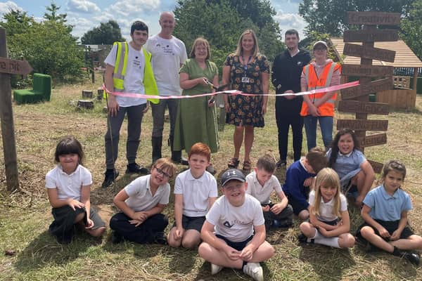 College and primary school students help build forest school