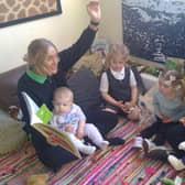 Staff members Louise Shore and Megan Cooper take some time to read with children at Little Learner’s Day nursery in Doncaster.