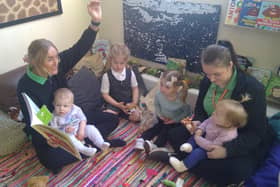 Staff members Louise Shore and Megan Cooper take some time to read with children at Little Learner’s Day nursery in Doncaster.