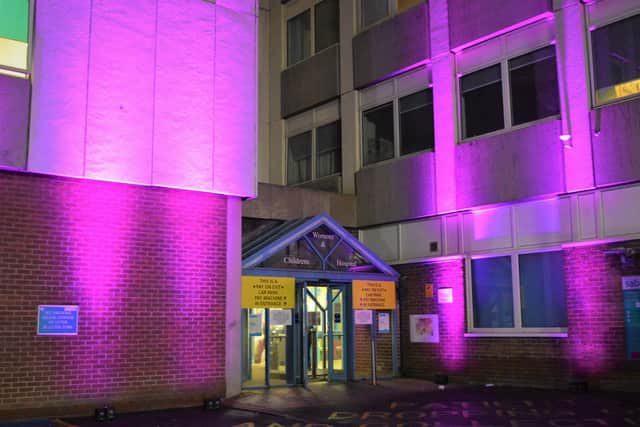 Entrance to the Women’s and Children’s Hospital illuminated purple