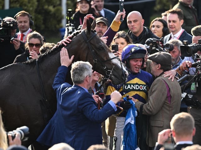 Former champion jockey Peter Scudamore, partner of trainer Lucinda Russell, embraces rider Derek Fox after a superb victory by CORACH RAMBLER in last year's Randox Grand National at Aintree. It came only a month after the mercurial chaser, based in Scotland, had completed successive wins in the Ultima Handicap Chase on the opening day of the Festival. Now the 10yo goes for the big one with an ambitious tilt at the Boodles Gold Cup on Friday (3.30) before returning to Aintree next month. Only two horses, Golden Miller and L'Escargot, have ever pulled off the Gold Cup/National double -- the former exactly 90 years ago.