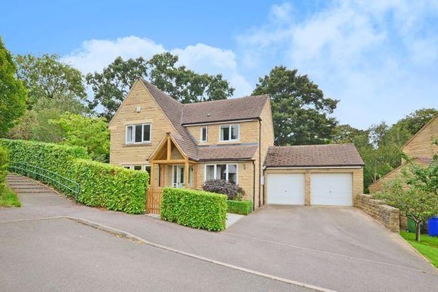 This four bedroom detached house has a large conservatory with windows overlooking the garden to two sides and French doors opening onto the garden at the rear and underfloor heating. It is light blue from the outside.