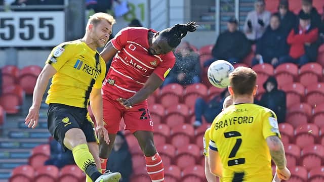 Joe Dodoo heads home Rovers' opening goal. Picture: Andrew Roe/AHPIX LTD