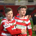 Harry Clifton (left) celebrates with teammate James Maxwell after Rovers saw off Harrogate.