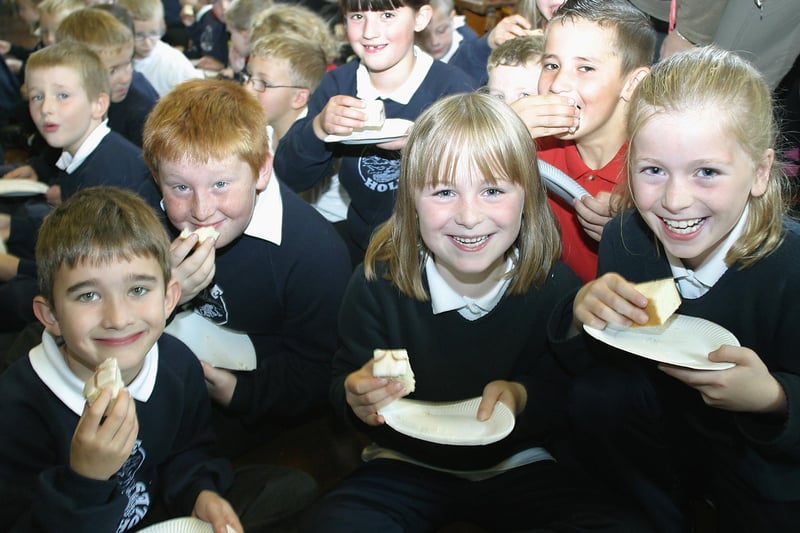 Dove Holes school extension, pupils celebrate with a slice of cake