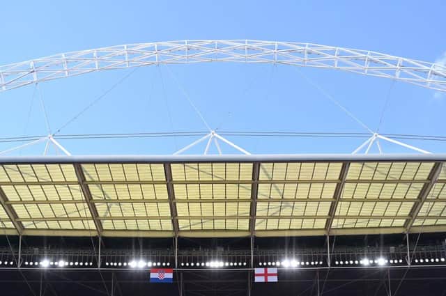 The England and Croatia flags are seen hung over the pitch at Wembley on the eve of their UEFA EURO 2020 Group D clash. Photo by GLYN KIRK/AFP via Getty Images