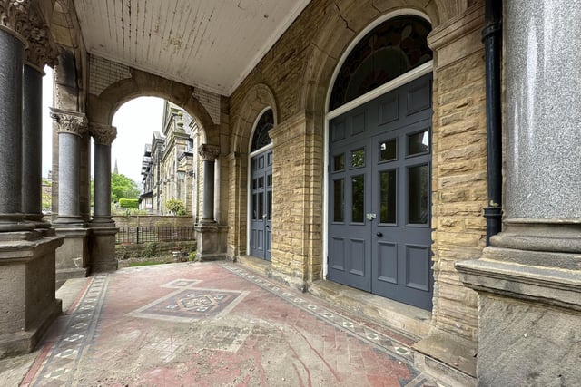 A south-facing courtyard garden lies next to this impressive entrance.
