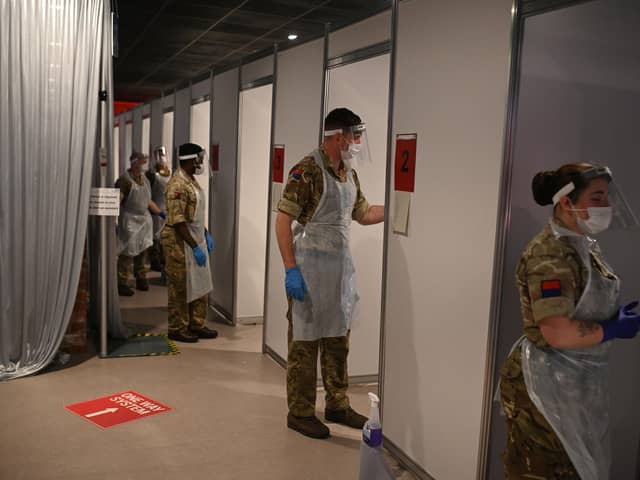 British Army soldiers, 19th Regiment Royal Artillery 5 Battery, staff testing booths inside Anfield Stadium in Liverpool (Photo by OLI SCARFF/AFP via Getty Images)