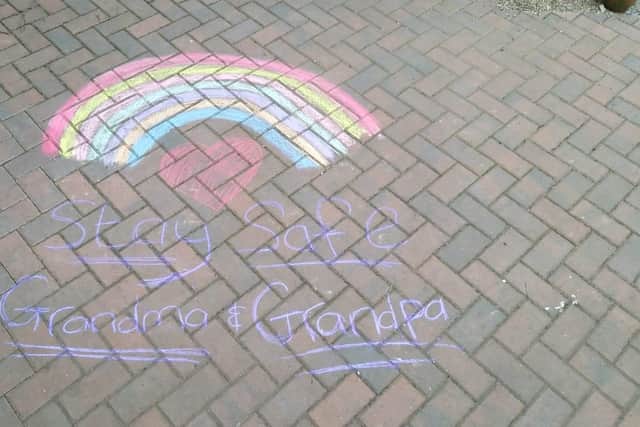 A heartfelt message featuring a rainbow, the symbol of lockdown for children