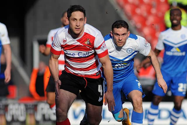 Dean Furman gets away from Jon Taylor, then of Peterborough United.