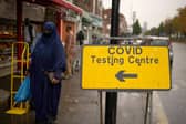 People wear face masks and PPE in Sheffield, England (Photo by Christopher Furlong/Getty Images)