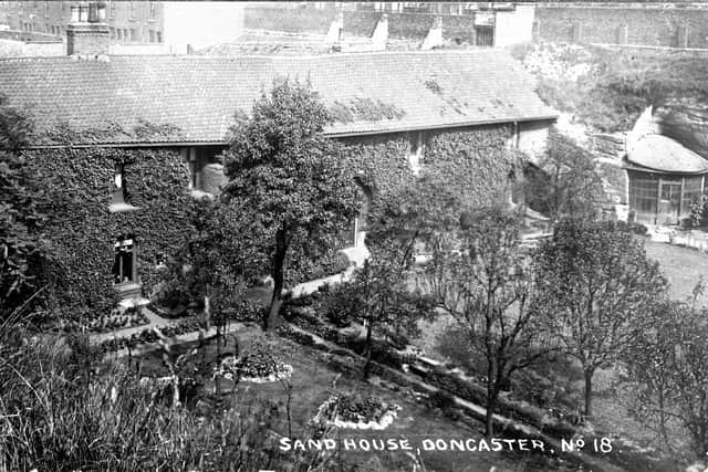 A general view of the Sand House, showing how it stood at a much lower level than the surrounding streets, being within a former quarry. The Cloisters tunnel ran through the ground adjacent to the former quarry (just off to the right of this photo).