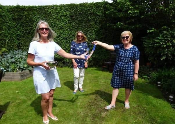 Doncaster St Leger Inner Wheel handover in the garden.
Presidents Fiona Gould and Christine Street hand over the  chain of office to Elaine Bowden after completing a very successful year - half in lockdown.