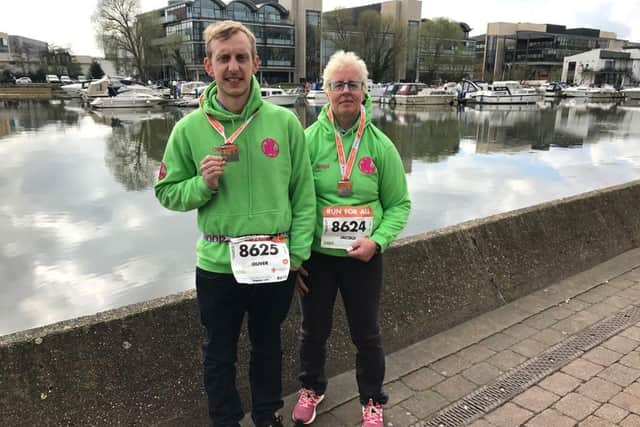 Jacqui (right) and her son Oliver lost ten stone in weight between them after taking up triathlon.