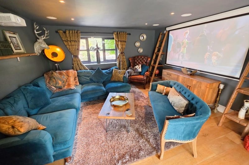 The plush cinema room with sound system could serve as another bedroom if preferred.