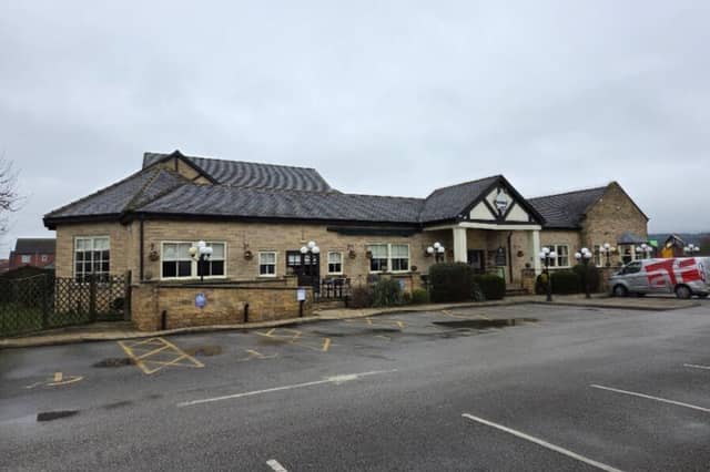 An exterior view of the Pastures Lodge property that is now for sale.