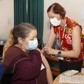 One patient gets their booster