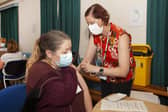 One patient gets their booster