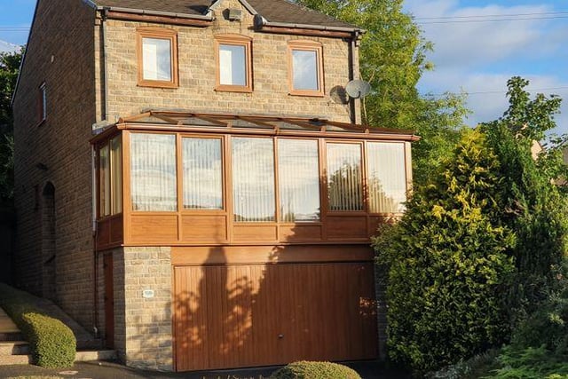 This four bedroom house has a conservatory with great views over a valley.
