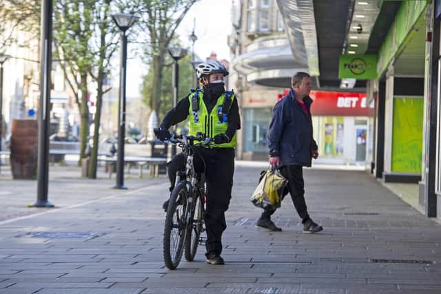 A Police Community Support Officer patrols the centre of Doncaster in a face mask for protection during to coronavirus pandemic. Picture Tony Johnson