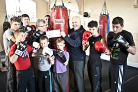 The late Ken Blood MBE, pictured with Doncaster Lions president Mick Maye and young boxers.