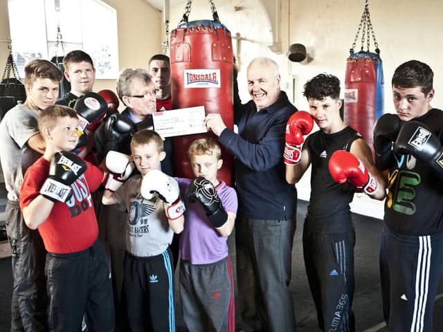The late Ken Blood MBE, pictured with Doncaster Lions president Mick Maye and young boxers.