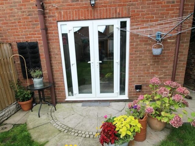 French doors open to the garden from the lounge.