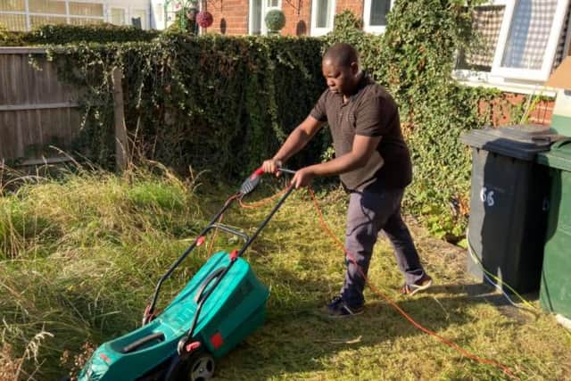 A member of the church mowing the lawn of a Doncaster person in need.