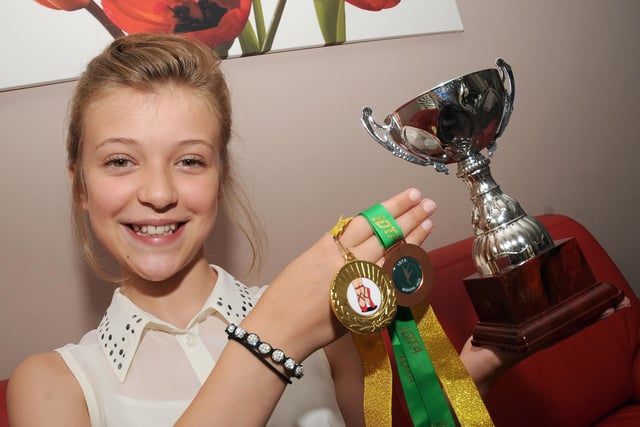 Molly Marsh,  at the age 11,, with some of her medals and trophies for dancing,, after she was picked to perform in the Sheffield Theatres production of Oliver. Picture: Andrew Roe