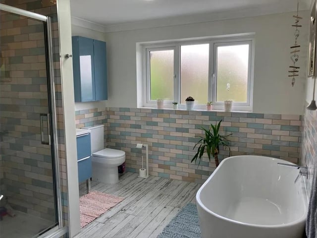 A contemporary bathroom with freestanding bath.