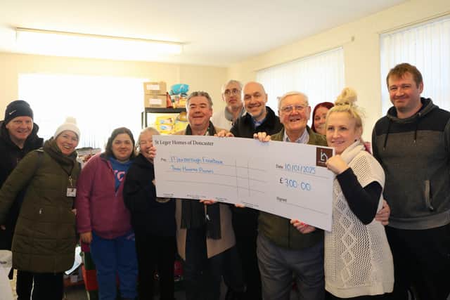 Lee Winterbottom (St Leger Homes Director of Property Services, fifth person from right), with Cllr Sean Gibbons (fifth person from left) and members of Mexborough Foodbank.