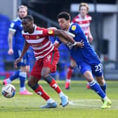 Fejiri Okenabirhie gets close attention from Ipswich's Andre Dozzell. Picture: Howard Roe/AHPIX