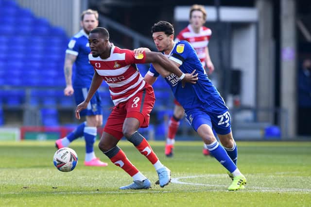 Fejiri Okenabirhie gets close attention from Ipswich's Andre Dozzell. Picture: Howard Roe/AHPIX