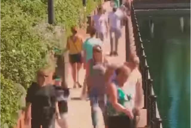 The clip shows hundreds of people flocking to Lakeside.
