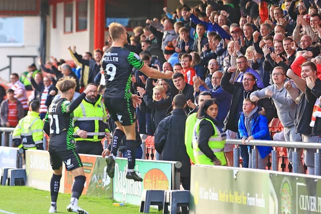 George Miller celebrates his goal to pull Doncaster Rovers level.