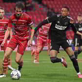 Daniel Jebbison (right) puts pressure on Rovers skipper Tom Anderson during the friendly with Sheffield United. Picture: Andrew Roe/AHPIX