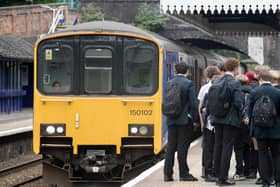 School students boarding a Northern service