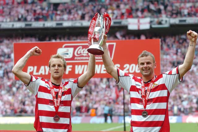 James Coppinger and Richie Wellens celebrate with the play-off trophy. Picture: Marie Caley