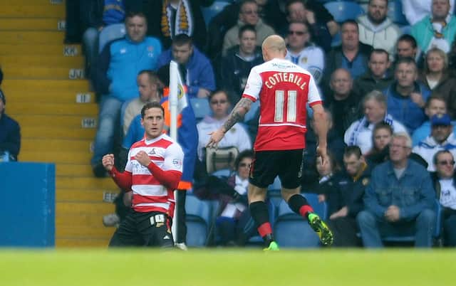 Billy Sharp celebrates his goal for Rovers at Leeds with David Cotterill