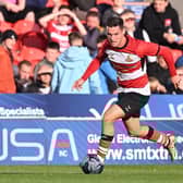 Doncaster's Luke Molyneux gets on the ball in Tuesday's win over Sheffield Wednesday.